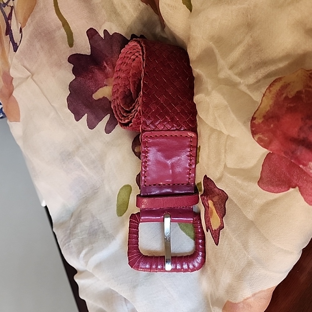 Leather magenta woven belt.